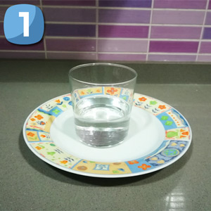 Step 1 Fill half a glass of water